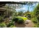 Picturesque backyard showcasing desert landscaping, a water feature, and ample space for outdoor enjoyment at 9722 E Mark Ln, Scottsdale, AZ 85262