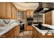 Stylish kitchen equipped with custom cabinetry, sleek appliances, and a functional island at 9722 E Mark Ln, Scottsdale, AZ 85262