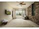 A spacious living room offers natural light, stone accents, and desert views at 9722 E Mark Ln, Scottsdale, AZ 85262