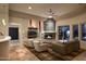 Inviting living room features a stone fireplace, comfortable seating, and abundant natural light at 9722 E Mark Ln, Scottsdale, AZ 85262