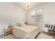 Bedroom featuring a large window and neutral tones at 12351 W Palmaire Ave, Glendale, AZ 85307