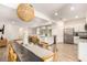 Open-concept dining and kitchen area featuring stainless steel appliances and a kitchen island at 12351 W Palmaire Ave, Glendale, AZ 85307