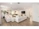 Open-concept living room featuring wood floors, recessed lighting, and an open floor plan at 12351 W Palmaire Ave, Glendale, AZ 85307