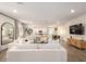 Bright, open living room featuring an open floor plan and a comfortable seating area at 12351 W Palmaire Ave, Glendale, AZ 85307