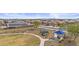 Community playground with slides and swings for Gathering fun in a well maintained neighborhood with solar panels on many homes at 12351 W Palmaire Ave, Glendale, AZ 85307
