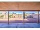 This backyard is covered with gravel and has a covered patio at 12905 W Crocus Dr, El Mirage, AZ 85335
