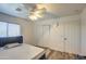 This bedroom features wood-look floors, a ceiling fan, and a closet at 12905 W Crocus Dr, El Mirage, AZ 85335