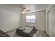 This bedroom features wood-look floors and a ceiling fan at 12905 W Crocus Dr, El Mirage, AZ 85335