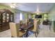 Dining room with elegant table and chairs, complemented by a built-in cabinet for sophisticated dining at 12905 W Crocus Dr, El Mirage, AZ 85335