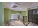 Upstairs hallway with hardwood floors, decorative railing, and natural light creates a welcoming space at 12905 W Crocus Dr, El Mirage, AZ 85335