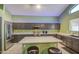 Kitchen with large island, stainless steel appliances, and ample counter space perfect for entertaining at 12905 W Crocus Dr, El Mirage, AZ 85335