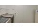 This laundry room offers a washer and a dryer and a door at 12905 W Crocus Dr, El Mirage, AZ 85335