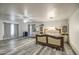 Large bedroom with hardwood floors, a ceiling fan, and ample natural light for a serene retreat at 12905 W Crocus Dr, El Mirage, AZ 85335