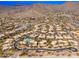 Aerial view of the residential community featuring a pool, desert landscaping and mountain views in Scottsdale, Arizona at 13300 E Via Linda -- # 1054, Scottsdale, AZ 85259