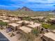 Aerial view of homes with desert landscaping and mountain views in Scottsdale, Arizona at 13300 E Via Linda -- # 1054, Scottsdale, AZ 85259