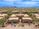 Aerial view of homes with three car garages and desert landscaping in Scottsdale, Arizona at 13300 E Via Linda -- # 1054, Scottsdale, AZ 85259