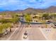 Gated community entrance with desert landscaping and mountain views at The Overlook in Scottsdale, Arizona at 13300 E Via Linda -- # 1054, Scottsdale, AZ 85259