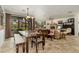 Open-concept dining room and living area with a view of the backyard and comfortable seating at 13300 E Via Linda -- # 1054, Scottsdale, AZ 85259