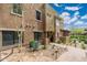 Beautiful two-story home featuring desert landscaping, a concrete walkway, and large windows at 13300 E Via Linda -- # 1054, Scottsdale, AZ 85259
