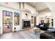 Comfortable living room featuring a fireplace, modern decor, and access to outdoor spaces at 13300 E Via Linda -- # 1054, Scottsdale, AZ 85259