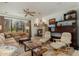 Inviting living room with a stone fireplace, comfortable seating, and plenty of natural light at 13300 E Via Linda -- # 1054, Scottsdale, AZ 85259