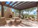Outdoor fireplace and seating area, complete with a dining table, for memorable moments at 13300 E Via Linda -- # 1054, Scottsdale, AZ 85259