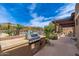 Outdoor barbecue and grilling area with a pergola, perfect for entertaining and outdoor dining at 13300 E Via Linda -- # 1054, Scottsdale, AZ 85259