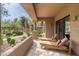 Desert home patio featuring sun loungers with desert landscaping, offering a tranquil outdoor space at 13300 E Via Linda -- # 1054, Scottsdale, AZ 85259
