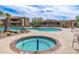 Beautiful community pool featuring a hot tub, pool, and lounge chairs for resident enjoyment at 13300 E Via Linda -- # 1054, Scottsdale, AZ 85259