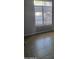 Bright bedroom featuring tile flooring and a large window with vertical blinds at 1449 E Highland Ave # 39, Phoenix, AZ 85014
