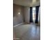 Neutral bedroom featuring tile floors, two-tone paint, and natural light from a window at 1449 E Highland Ave # 39, Phoenix, AZ 85014