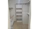 Walk-in closet with built-in shelving and hanging rods for efficient storage at 1449 E Highland Ave # 39, Phoenix, AZ 85014