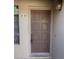 Traditional brown front door with a classic design, set in a neutral-toned exterior at 1449 E Highland Ave # 39, Phoenix, AZ 85014