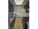 Functional kitchen with ample counter space, dark cabinetry, and white appliances at 1449 E Highland Ave # 39, Phoenix, AZ 85014