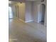 Neutral toned living room featuring tile flooring, arched doorways, and bright light at 1449 E Highland Ave # 39, Phoenix, AZ 85014
