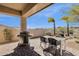 Relaxing covered patio featuring an outdoor kitchen and stunning desert views at 16113 E Andrew Dr, Fountain Hills, AZ 85268