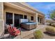 Outdoor patio area featuring a hot tub and lounge chairs for relaxing outside at 16113 E Andrew Dr, Fountain Hills, AZ 85268