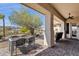 Relaxing patio with furniture, covered area, and views of the desert landscape at 16113 E Andrew Dr, Fountain Hills, AZ 85268
