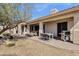 Inviting back patio with desert landscaping and covered seating area, ideal for outdoor dining and relaxation at 16113 E Andrew Dr, Fountain Hills, AZ 85268