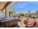 Beautiful backyard with a jacuzzi, comfortable seating, desert landscaping, and great mountain views at 16113 E Andrew Dr, Fountain Hills, AZ 85268