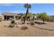 Expansive backyard showcasing mature desert landscaping, creating a private and peaceful retreat at 16113 E Andrew Dr, Fountain Hills, AZ 85268
