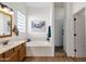 Bright bathroom featuring a soaking tub, large window, and separate shower at 16113 E Andrew Dr, Fountain Hills, AZ 85268