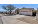 Charming single-story home with desert landscaping, arched entryway, and a spacious two-car garage at 16113 E Andrew Dr, Fountain Hills, AZ 85268