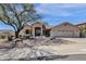 Charming single-story home with desert landscaping, arched entryway, and a spacious two-car garage at 16113 E Andrew Dr, Fountain Hills, AZ 85268