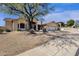 Charming single-story home with desert landscaping, arched entryway, and a spacious two-car garage at 16113 E Andrew Dr, Fountain Hills, AZ 85268