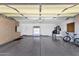 Spacious garage with ample storage cabinets and epoxy flooring, perfect for parking and projects at 16113 E Andrew Dr, Fountain Hills, AZ 85268