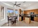 Bright kitchen with granite countertops, black appliances, and a breakfast nook overlooking the backyard at 16113 E Andrew Dr, Fountain Hills, AZ 85268