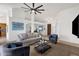 Open concept living room features neutral walls, carpeted floors, ceiling fan, and views to multiple living spaces at 16113 E Andrew Dr, Fountain Hills, AZ 85268