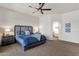 Serene main bedroom with soft carpet, a ceiling fan, and access to an adjoining sitting area at 16113 E Andrew Dr, Fountain Hills, AZ 85268