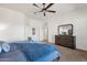 Spacious main bedroom with a ceiling fan, soft carpet, and traditional-style furniture at 16113 E Andrew Dr, Fountain Hills, AZ 85268